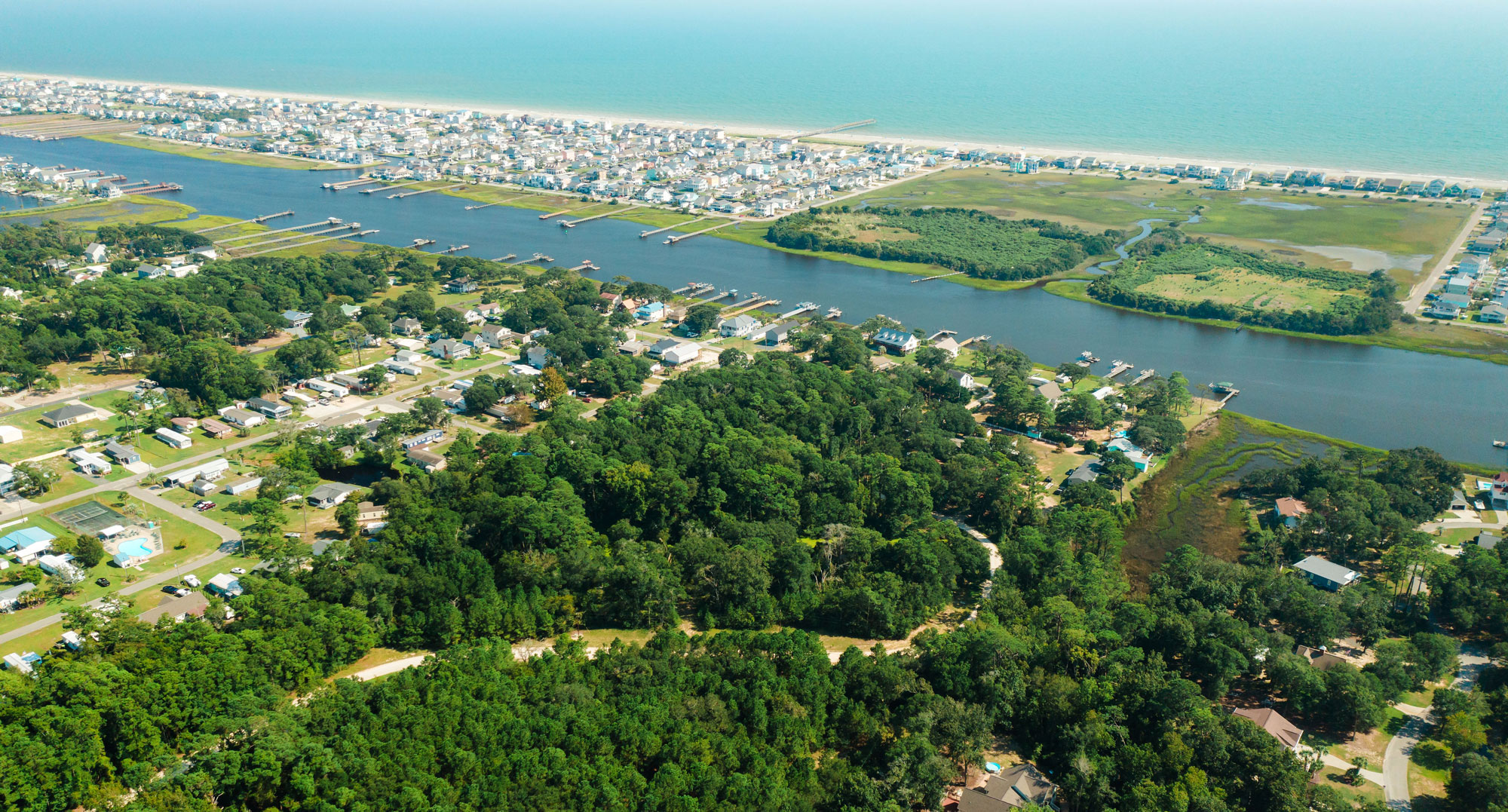 Aerial view of ocean + waterway