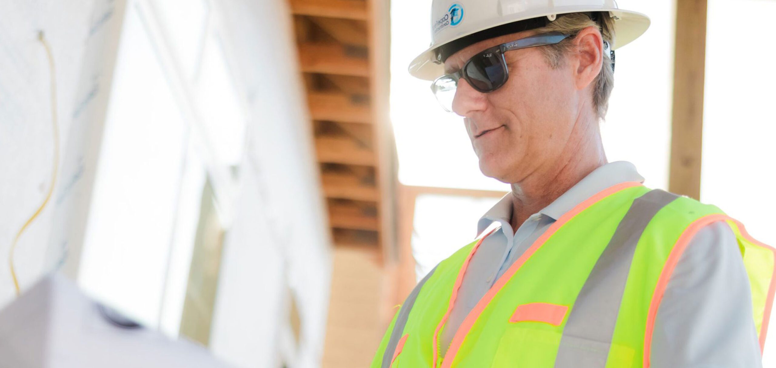 Construction worker reviewing a document on site