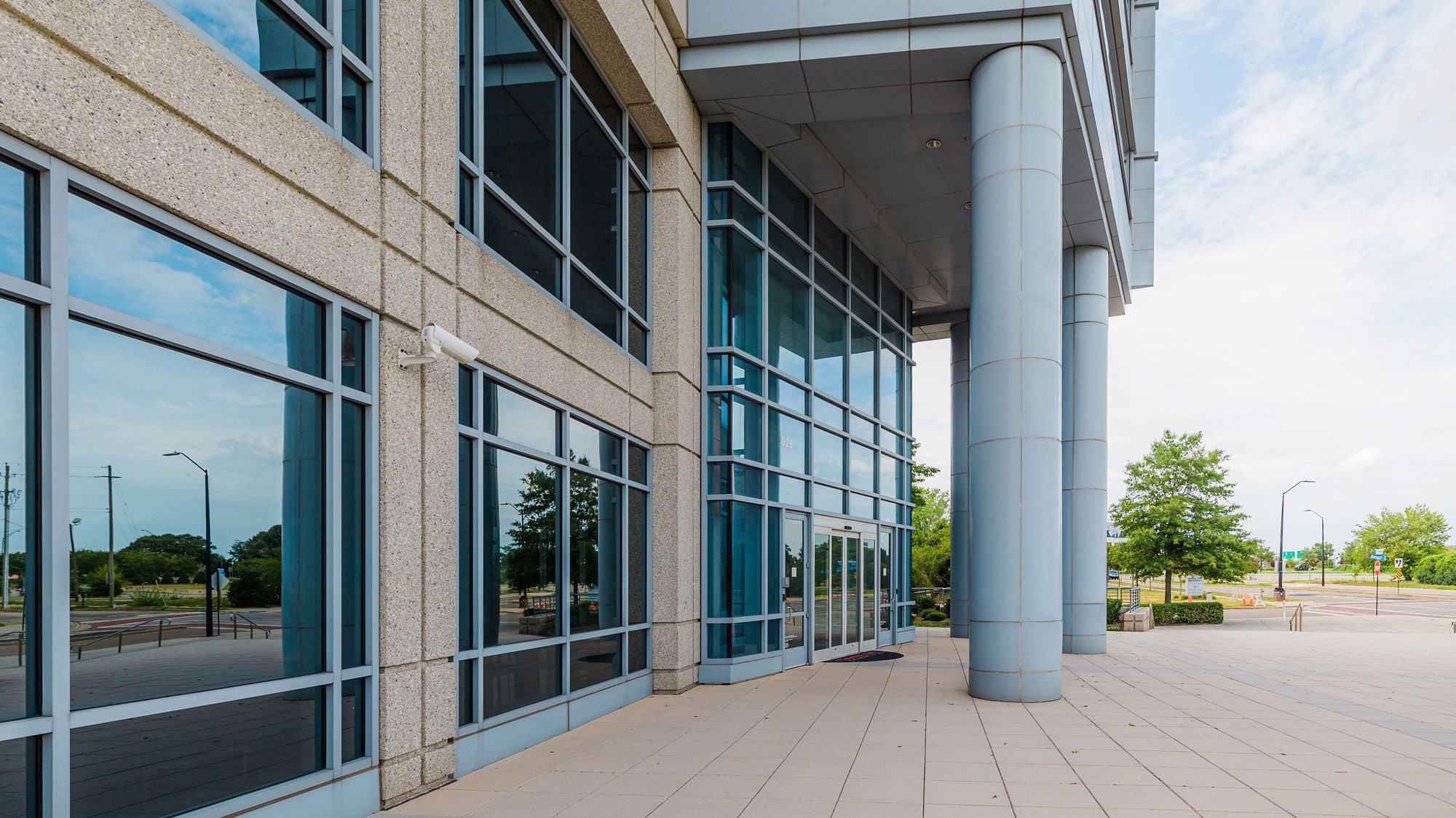 Entrance to building with large reflective mirrors