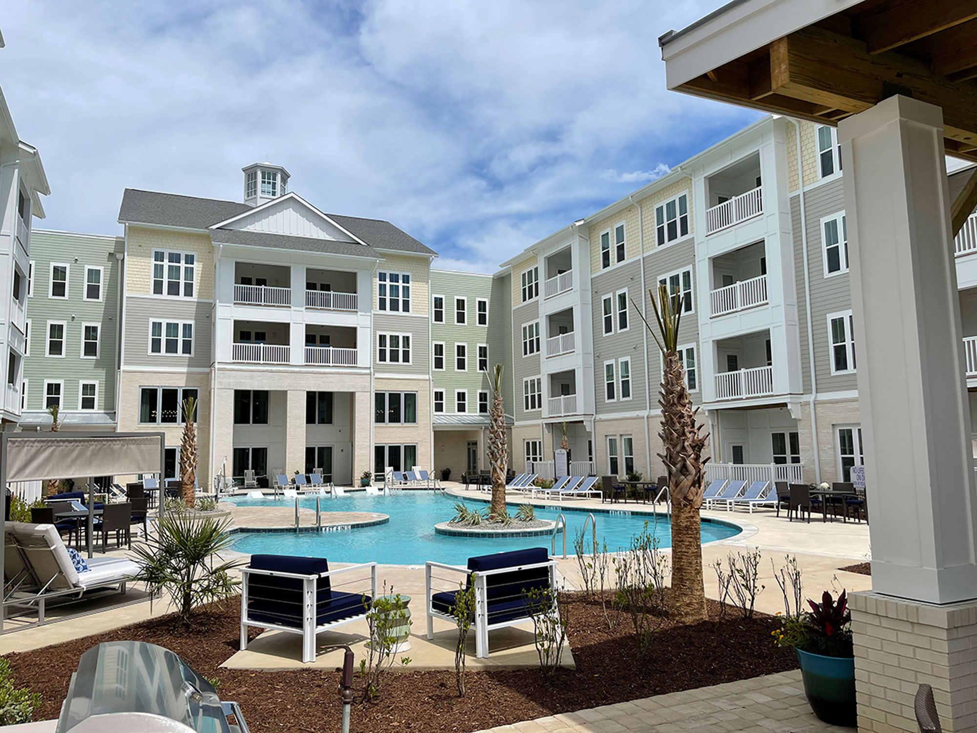 Inspire at Coastal Grand exterior: pool + courtyard
