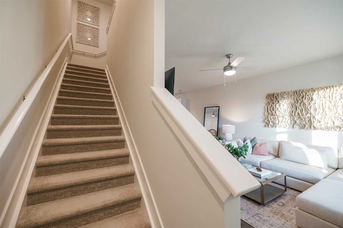 Riverwood Apartments interior: staircase + living room
