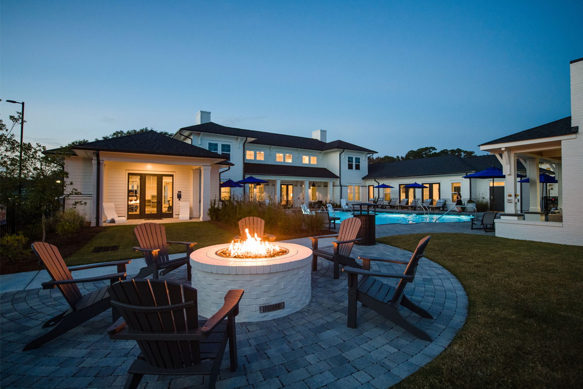 Woodlands Landing exterior: fire pit + pool
